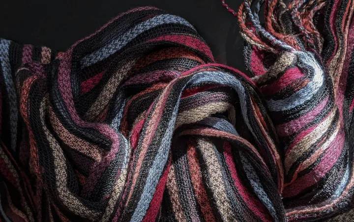 A soft striped scarf with a fringe